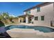 House with large kidney shaped pool and patio at 130 N Bay Dr, Gilbert, AZ 85233