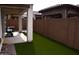 Artificial turf backyard with covered patio at 1255 N Arizona Ave # 1099, Chandler, AZ 85225