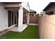 Private backyard with covered patio and turf at 1255 N Arizona Ave # 1099, Chandler, AZ 85225