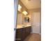 Double vanity bathroom with dark brown cabinets and a large mirror at 1255 N Arizona Ave # 1099, Chandler, AZ 85225