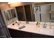 Modern bathroom featuring double sinks and a large mirror at 1255 N Arizona Ave # 1099, Chandler, AZ 85225