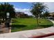 Designated pet area with grassy lawn and waste disposal at 1255 N Arizona Ave # 1099, Chandler, AZ 85225