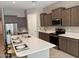 Modern kitchen with stainless steel appliances and an island at 1255 N Arizona Ave # 1099, Chandler, AZ 85225