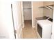 Bright laundry room, washer, dryer, and shelving at 1255 N Arizona Ave # 1099, Chandler, AZ 85225