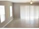 Large living room with tile flooring and sliding glass doors at 1255 N Arizona Ave # 1099, Chandler, AZ 85225