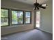 Bedroom with backyard access and ceiling fan at 1187 E Tonto Dr, Chandler, AZ 85249