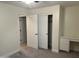 Bright bedroom with double door closet and built-in desk at 1187 E Tonto Dr, Chandler, AZ 85249