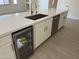 Kitchen island with a sink, dishwasher, and beverage cooler at 1187 E Tonto Dr, Chandler, AZ 85249