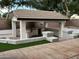 Outdoor kitchen with built-in grill and seating at 1187 E Tonto Dr, Chandler, AZ 85249