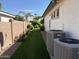 Landscaped side yard with artificial turf and two AC units at 1187 E Tonto Dr, Chandler, AZ 85249