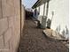 Side yard with AC units and gravel ground cover at 1187 E Tonto Dr, Chandler, AZ 85249