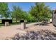Expansive backyard with mature trees, gravel and brick paver hardscape at 12651 S 71St St, Tempe, AZ 85287