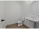 Bathroom features pristine toilet and classic pedestal sink at 12651 S 71St St, Tempe, AZ 85287