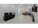 Spacious room with light-colored tile flooring and white walls is versatile and ready for your personal touch at 12651 S 71St St, Tempe, AZ 85287