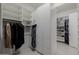 Well-organized walk-in closet with custom shelving, drawers, and hanging rods for efficient storage at 12651 S 71St St, Tempe, AZ 85287