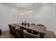 Dining room featuring a wooden table with eight chairs and a stunning light fixture at 12651 S 71St St, Tempe, AZ 85287