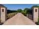 Long, gated driveway leads to a private and secure property at 12651 S 71St St, Tempe, AZ 85287