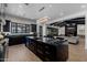 Spacious kitchen featuring a large island, black cabinets, and an open floor plan at 12651 S 71St St, Tempe, AZ 85287