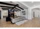 Elegant living room featuring a modern fireplace, comfortable seating, wood-look tile floors and beamed ceilings at 12651 S 71St St, Tempe, AZ 85287