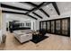 Expansive living room with dark wood beams, open floor plan, and seamless indoor-outdoor living at 12651 S 71St St, Tempe, AZ 85287