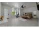 Bright main bedroom with white walls and tile floors plus a bed with gold accents at 12651 S 71St St, Tempe, AZ 85287