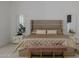 Luxurious main bedroom featuring neutral decor, a plush bed, and stylish bedside tables with matching decor at 12651 S 71St St, Tempe, AZ 85287