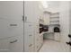 Modern office with built-in cabinets and dual monitors at 12651 S 71St St, Tempe, AZ 85287