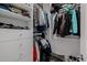 Spacious walk-in closet featuring white built-in shelves and rods, offering ample storage space for clothes and accessories at 12651 S 71St St, Tempe, AZ 85287
