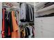 Spacious walk-in closet providing ample storage with shelving and hanging areas, ideal for organizing clothing and accessories at 12651 S 71St St, Tempe, AZ 85287