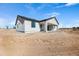 New construction home with desert landscaping and covered patio at 22750 E Roper Ln, Florence, AZ 85132