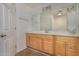 Bathroom boasting light wood cabinets and a large vanity mirror at 25809 S Hollygreen Dr, Sun Lakes, AZ 85248