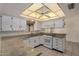 View of the kitchen with granite countertops and white cabinets at 25809 S Hollygreen Dr, Sun Lakes, AZ 85248