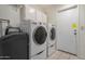 Laundry room with washer, dryer, and ample cabinet storage at 25809 S Hollygreen Dr, Sun Lakes, AZ 85248