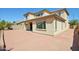 Exterior of home featuring red brick pavers, a covered patio, and a block wall at 19591 W Lincoln St, Buckeye, AZ 85326