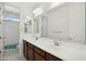 Bright bathroom featuring a double sink vanity and separate toilet/shower room at 19591 W Lincoln St, Buckeye, AZ 85326