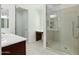 Bathroom featuring a glass shower, vanity with dark wood cabinets, and tile floors at 19591 W Lincoln St, Buckeye, AZ 85326