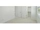 Vacant bedroom with plush carpeting, white walls, and window with blinds at 19591 W Lincoln St, Buckeye, AZ 85326