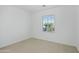 Bright bedroom features neutral carpet and large windows providing ample natural light at 19591 W Lincoln St, Buckeye, AZ 85326