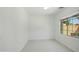 Bright bedroom with tile floors and a large window offering plenty of natural light at 19591 W Lincoln St, Buckeye, AZ 85326