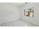 Bright bedroom with tile floors and a large window offering plenty of natural light at 19591 W Lincoln St, Buckeye, AZ 85326