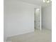 Empty bedroom showcasing neutral carpeting and closet access at 19591 W Lincoln St, Buckeye, AZ 85326