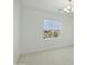 Vacant bedroom with neutral carpeting and a traditional chandelier at 19591 W Lincoln St, Buckeye, AZ 85326