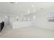 Spacious bonus room with neutral paint, carpet, and ample natural light at 19591 W Lincoln St, Buckeye, AZ 85326