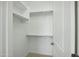 Walk-in closet with shelving and a door with hardware at 19591 W Lincoln St, Buckeye, AZ 85326