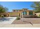 Charming two-story home featuring a three-car garage, desert landscaping, and a tile roof at 19591 W Lincoln St, Buckeye, AZ 85326