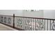 Hallway upstairs showcasing a decorative iron railing and natural light at 19591 W Lincoln St, Buckeye, AZ 85326