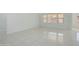 Bright and airy living room with tile flooring and ample natural light at 19591 W Lincoln St, Buckeye, AZ 85326