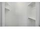 Walk-in closet offers ample shelving and storage solutions for organizing your wardrobe at 19591 W Lincoln St, Buckeye, AZ 85326