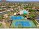 Aerial view of the community, tennis courts, pool and surrounding neighborhood at 3518 N Shadow Trl, Mesa, AZ 85207