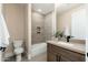 Well-lit bathroom with a shower-tub, modern vanity, and neutral color scheme at 3518 N Shadow Trl, Mesa, AZ 85207